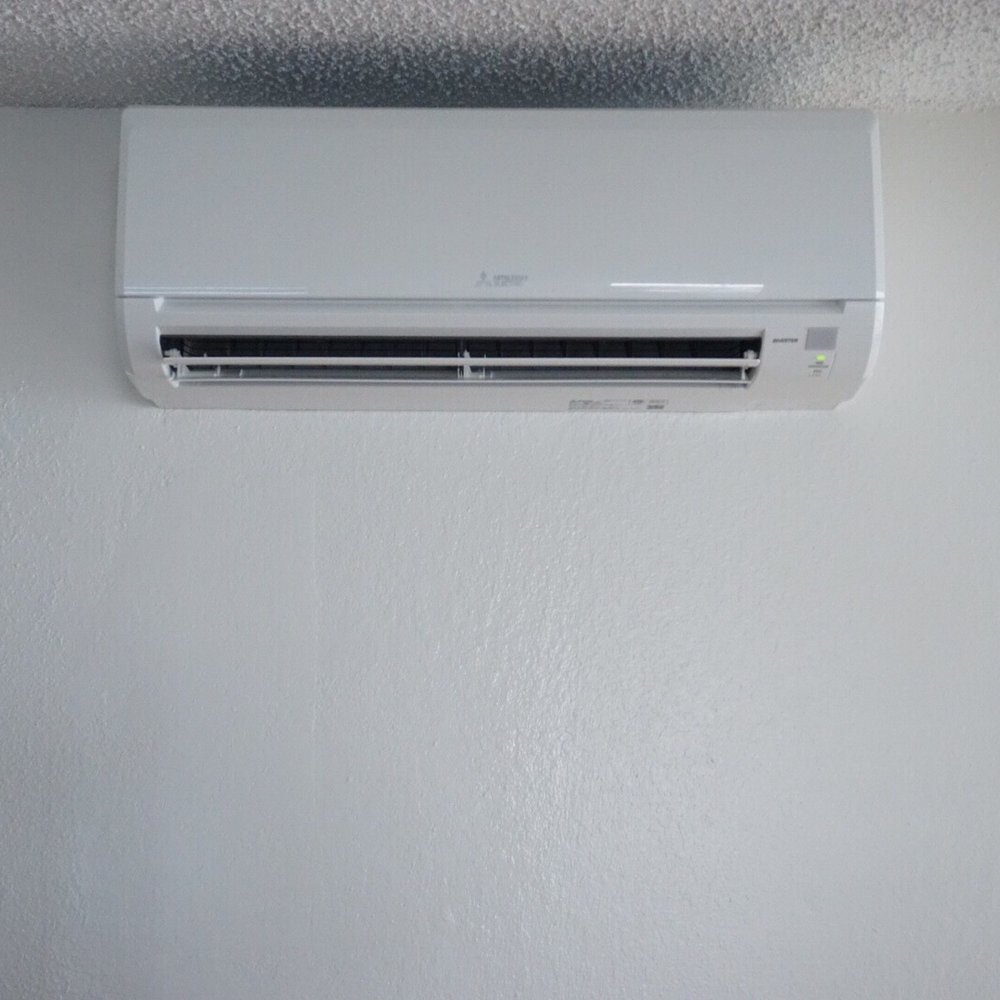Cool Living - Lower living room with unit on interior wall with all piping running inside of wall. 12k BTU - Heating & Air Conditioning/HVAC Near Me Cool Living - Lower living room with unit on interior wall with all piping running inside of wall. 12k BTU - Heating & Air Conditioning/HVAC Near Me