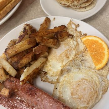Breakfast Station - Classic meat platter with potatoes and a polish sausage swirl pancakes (mini) - Breakfast & Brunch Near Me - Leesburg, Florida