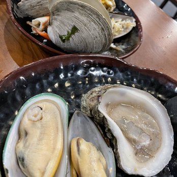 Old Town Hot Pot - Clam shell on the background, mussels, oyster. - Hot Pot Near Me - Aurora, Colorado Old Town Hot Pot - Clam shell on the background, mussels, oyster. - Hot Pot Near Me - Aurora, Colorado