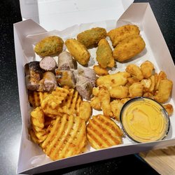 Wisconsin Sampler with Jalapeño Poppers, Cheese Curds, beer cheese, waffle fries, and a sliced brat (not the doll)