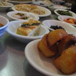 Han Yang Korean Bar-B-Q Restaurant - all the wonderful side dishes.. (* potatoes is the close one ) :D
