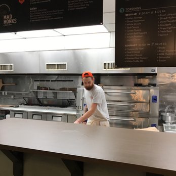 Mad Monks Pizza - a man standing behind a counter - Pizza Near Me - Mason, Ohio Mad Monks Pizza - a man standing behind a counter - Pizza Near Me - Mason, Ohio