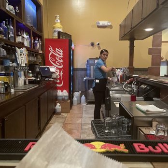 Agaves - a woman preparing food in a restaurant kitchen - Mexican Near Me - Hebron, Kentucky