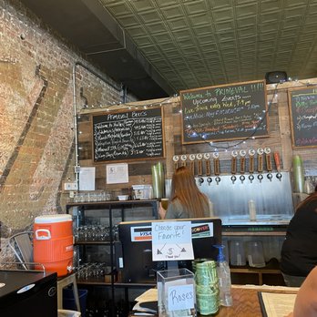 Primeval Brewing - a woman sitting at a bar - Breweries Near Me - Noblesville, Indiana Primeval Brewing - a woman sitting at a bar - Breweries Near Me - Noblesville, Indiana