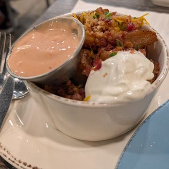 The Breakfast Company - Breakfast potatoes with some delicious sauce and sour cream - Breakfast & Brunch Near Me - Bradenton, Florida The Breakfast Company - Breakfast potatoes with some delicious sauce and sour cream - Breakfast & Brunch Near Me - Bradenton, Florida