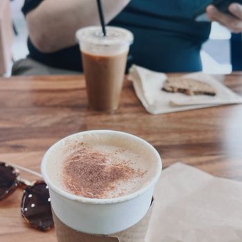 Agape Café - Honey cinnamon latte, iced Americano, and a chocolate chip cookie - Bakeries Near Me - Spring, Texas Agape Café - Honey cinnamon latte, iced Americano, and a chocolate chip cookie - Bakeries Near Me - Spring, Texas