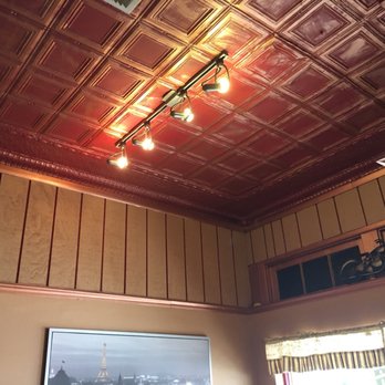 Bridge Street Coffee & Tea - Antique tin roof in part of the store. Old world Charm! - Coffee & Tea Near Me - Labelle, Florida