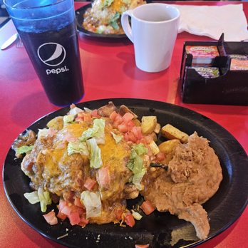 Rory's Diner - Breakfast chili rellano with scrambled eggs, refried beans, and smothered in green chili. - Diners Near Me - Parker, Colorado Rory's Diner - Breakfast chili rellano with scrambled eggs, refried beans, and smothered in green chili. - Diners Near Me - Parker, Colorado