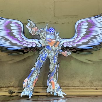 Signfastic - Optimus Prime built from channel letter materials 6' tall Angel Wings built from channel letter material 15' across, 7.5' each side - Advertising Near Me - Ontario, California
