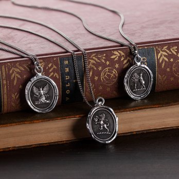 Fred & Co - Pyrrha: Hand stamped Talismans made from 18th & 19th Century wax seals. Available in solid Bronze or Sterling Silver. - Women's Clothing Near Me - Fish Creek, Wisconsin Fred & Co - Pyrrha: Hand stamped Talismans made from 18th & 19th Century wax seals. Available in solid Bronze or Sterling Silver. - Women's Clothing Near Me - Fish Creek, Wisconsin