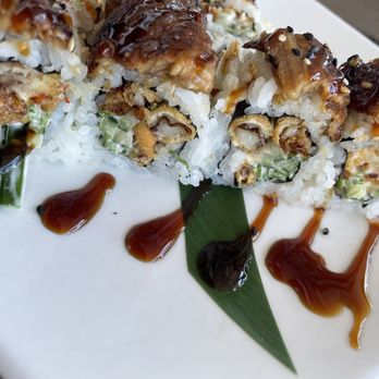 Harbor Docks - BLACK DRAGON fried soft shell crab, avocado, cucumber, green onion, spicy sauce topped with eel, eel sauce - Sushi Bars Near Me - Destin, Florida