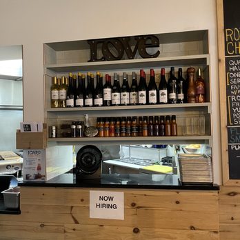 Sin & Grin - a counter with a sign that says now hiring - Tacos Near Me - Gaithersburg, Maryland