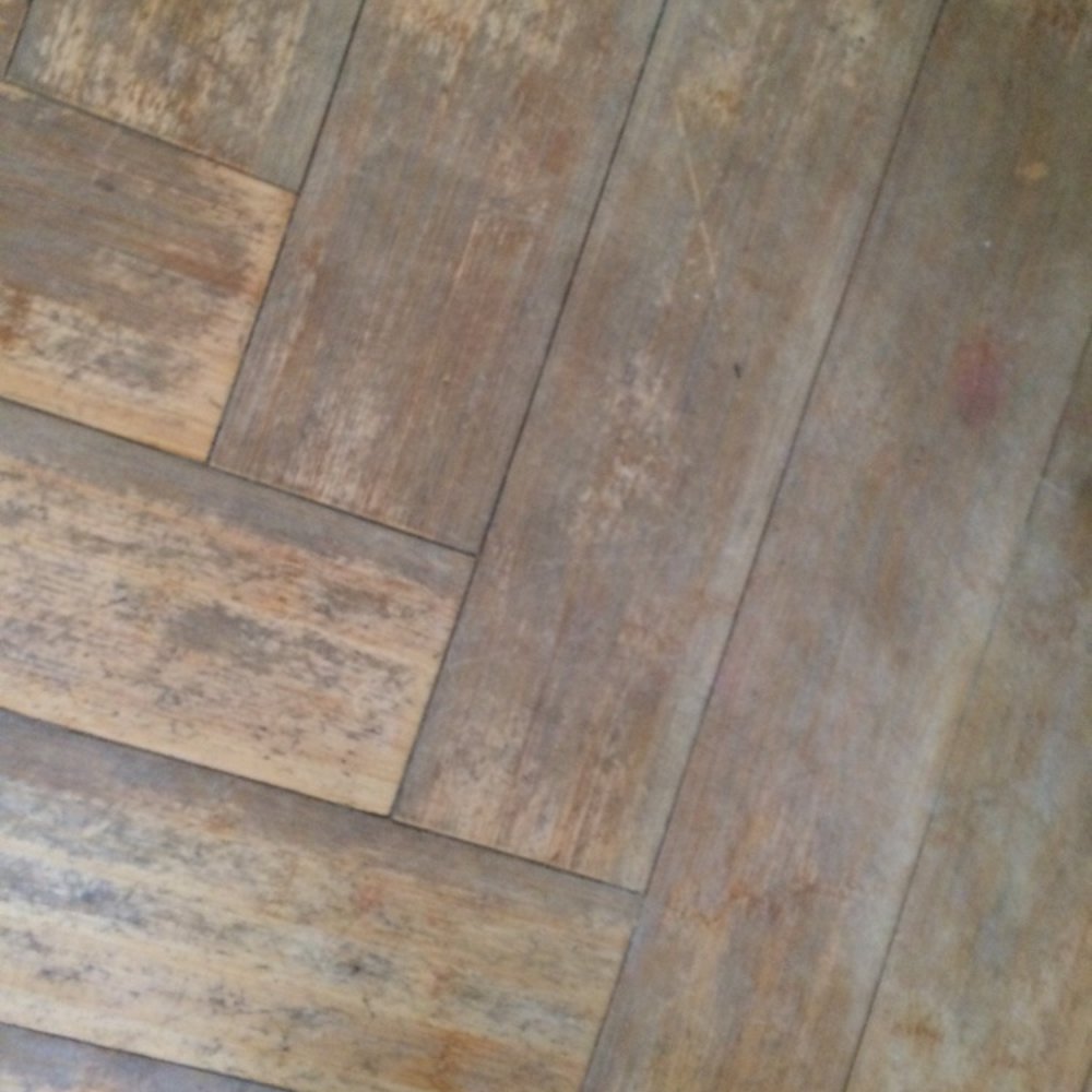 Kaiser Realty - Kitchen floors.  Apparently prior tenants had sandpaper on their shoes? - Real Estate Services Near Me - Orange Beach, Alabama