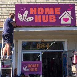 FASTSIGNS - Petaluma - Chad, from our sister company, Peace Out Junk Hauling, installing our new roof sign!