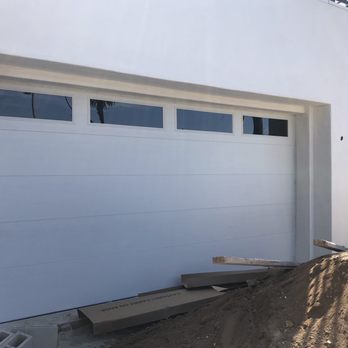L & C Garage Doors - White woodgrain flush door with windows - Garage Door Services Near Me - Paramount, California L & C Garage Doors - White woodgrain flush door with windows - Garage Door Services Near Me - Paramount, California