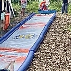 Mulch & More - Mulch & More -- wood chips to stabilize 100' backyard waterslide