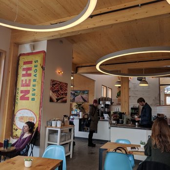 Treeline Coffee Roasters - Dining area looking towards the front order counter area - Coffee & Tea Near Me - Bozeman, Montana Treeline Coffee Roasters - Dining area looking towards the front order counter area - Coffee & Tea Near Me - Bozeman, Montana