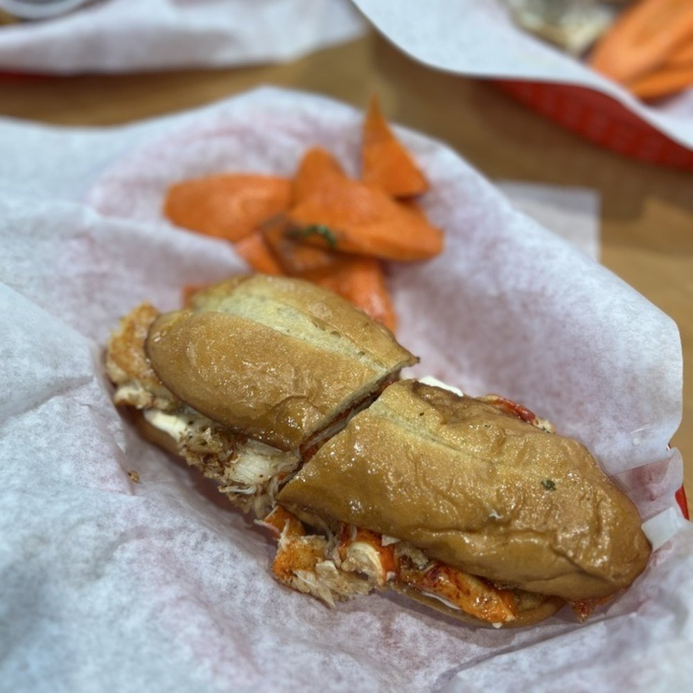 Fisherman's Cove - lobster roll: chunks of lobster tossed in garlic butter on a hoagie roll with mayo = $28 - Seafood Near Me - Bodega Bay, California Fisherman's Cove - lobster roll: chunks of lobster tossed in garlic butter on a hoagie roll with mayo = $28 - Seafood Near Me - Bodega Bay, California