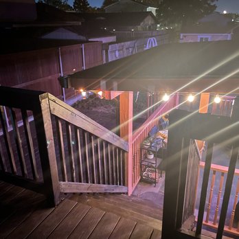 HomeDoc Construction - a view of a deck at night - General Contractors Near Me - Metairie, Louisiana HomeDoc Construction - a view of a deck at night - General Contractors Near Me - Metairie, Louisiana