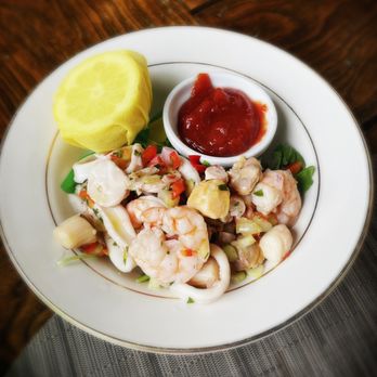 OHK Bar & Restaurant - Seafood salad (poached shrimp, bay scallops, PEI mussels, calamari, octopus, lemon, cocktail sauce) - American Near Me - Huntington, New York OHK Bar & Restaurant - Seafood salad (poached shrimp, bay scallops, PEI mussels, calamari, octopus, lemon, cocktail sauce) - American Near Me - Huntington, New York