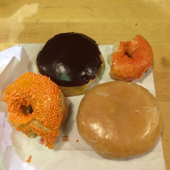 SloDoCo Donuts - From left to right: Bavarian, Georgia Peach, Thai Tea, and Raspberry Filled. Worth trying each! - Donuts Near Me - San Luis Obispo, California