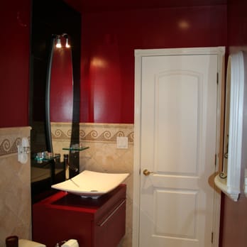 Vescos Enterprises - a bathroom with red walls - General Contractors Near Me Vescos Enterprises - a bathroom with red walls - General Contractors Near Me