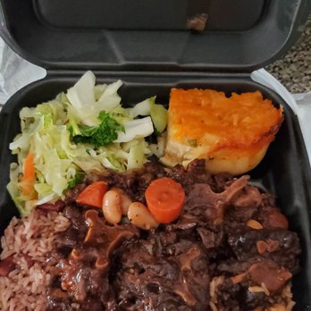 Fiery Irie Jamaican Restaurant - Large Oxtail dinner with cabbage, mac and cheese, and peas and rice. - Caribbean Near Me - Pembroke Pines, Florida