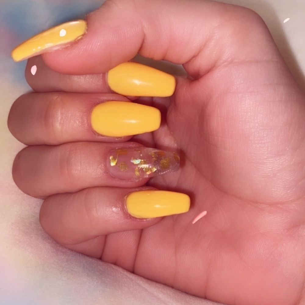 Summer Sun by DNC gel with golden flakes on the ring finger nail. Summer Sun by DNC gel with golden flakes on the ring finger nail.