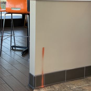 Dunkin' - a bar with orange chairs in a restaurant - Donuts Near Me - Buffalo Grove, Illinois Dunkin' - a bar with orange chairs in a restaurant - Donuts Near Me - Buffalo Grove, Illinois