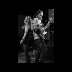 Mojo's Music Academy - Owner's of Mojo's with their band Mojomama