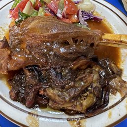 Lamb shank, fried eggplant and salad Lamb shank, fried eggplant and salad