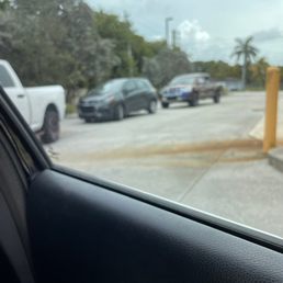 a view of a parking lot from inside a car a view of a parking lot from inside a car