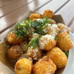 LP Street Food - Lp's tots. Gravy, Queso, cotija All the good stuff is on the bottom