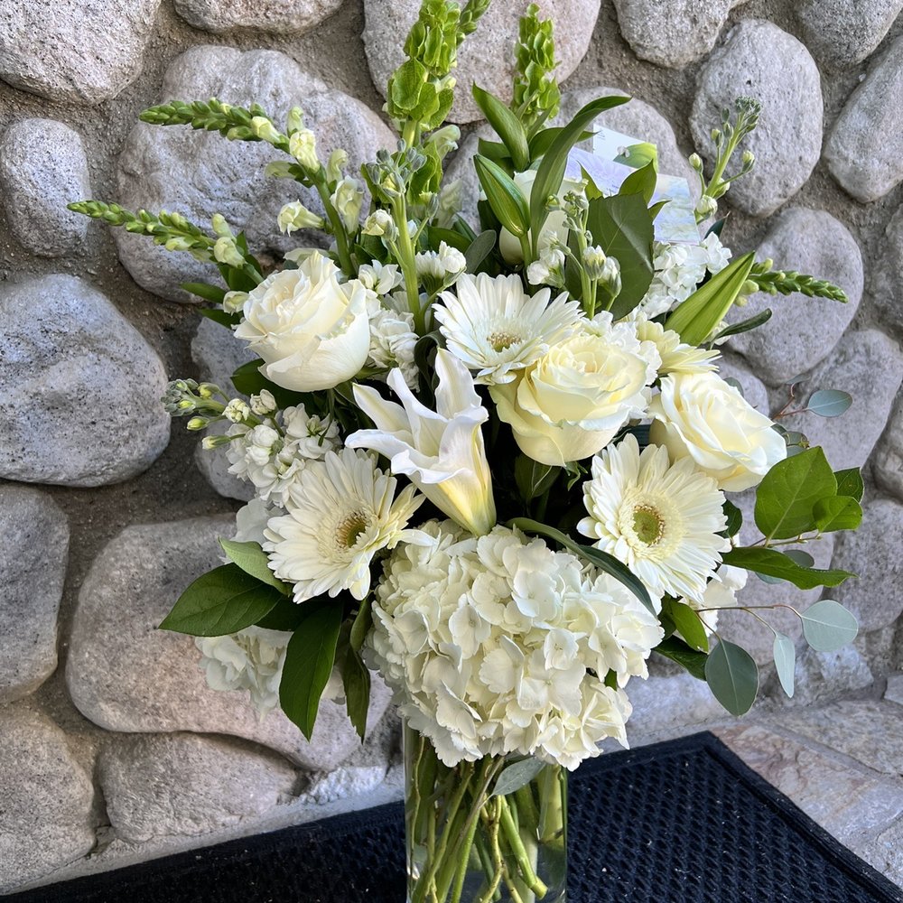All About Flowers - Style name is serenity, but I made a request for some adjustment in the type of flowers. Again, this shop is so accommodating! - Flowers & Gifts Near Me - Trabuco Canyon, California All About Flowers - Style name is serenity, but I made a request for some adjustment in the type of flowers. Again, this shop is so accommodating! - Flowers & Gifts Near Me - Trabuco Canyon, California