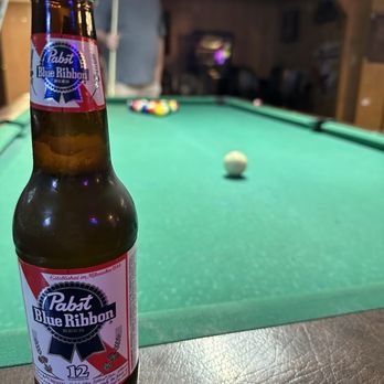 J&J Tavern - a beer bottle on a pool table - Pubs Near Me - Charlotte, North Carolina J&J Tavern - a beer bottle on a pool table - Pubs Near Me - Charlotte, North Carolina