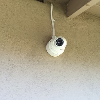 Epic Alarm - 1080p outdoor camera.  Wire exposed on this camera due to location.  Other two cameras have hidden wires. - Security Systems Near Me