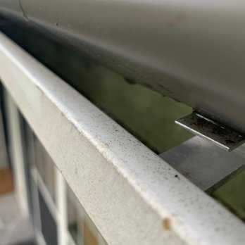Gutter Cover KC - Advantage Gutter Guard - Gutter Covers installed on our home with heavy-duty brackets and clear gutters post rainfall. - Gutter Services Near Me - Lee's Summit, Missouri