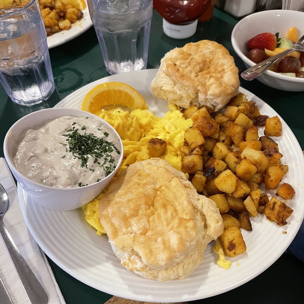 The Frog Pond - Biscuits and gravy with eggs and home fries - Breakfast & Brunch Near Me - St Pete Beach, Florida The Frog Pond - Biscuits and gravy with eggs and home fries - Breakfast & Brunch Near Me - St Pete Beach, Florida
