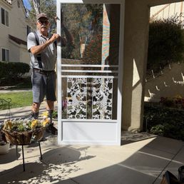 Eric holding my new screen door.