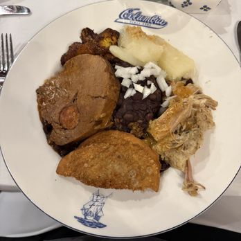 Columbia Restaurant - Roast, pork, beef empanadas, plantains, rice and beans, potato  (I asked for a surprise me dinner and it was about $24) - Spanish Near Me - Clearwater Beach, Florida