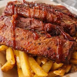 Eli's Kitchenette - Bbq ribs are spiced with a smoky sweet dry rub and home made bbq sauce that is marinated in brown sugar, paprika, garlic powder, blk pepper