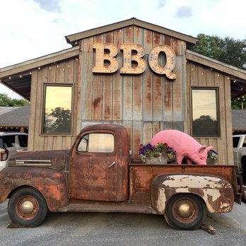 Smokin Pig - an old rusty truck with a sign that says bbq - Barbeque Near Me - Easley, South Carolina
