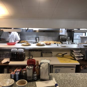 Henrys Diner - View from counter into kitchen. Piles of hash browns. - Diners Near Me - Burlington, Vermont