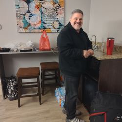 Microtel Inn & Suites by Wyndham Triadelphia - My husband at the spacious bar, sink and fridge area.