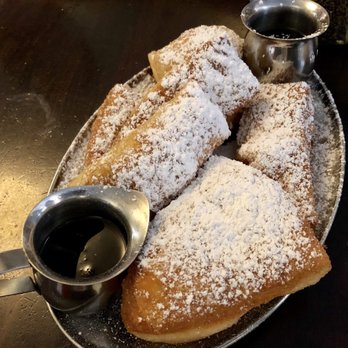 Syrup Downtown - Beignets with Cinnamon Sugar Glaze and Powdered Sugar - Syrup Downtown Denver - Breakfast & Brunch Near Me - Denver, Colorado Syrup Downtown - Beignets with Cinnamon Sugar Glaze and Powdered Sugar - Syrup Downtown Denver - Breakfast & Brunch Near Me - Denver, Colorado