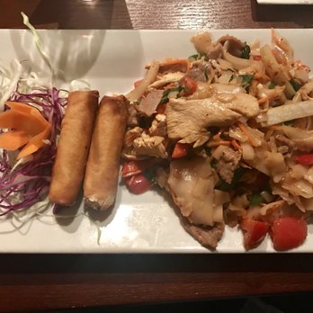 Spice - Dinner portion of drunken noodles w/chicken and beef. Spice level 3 w/crunchy spring rolls. - Thai Near Me - Fort Worth, Texas Spice - Dinner portion of drunken noodles w/chicken and beef. Spice level 3 w/crunchy spring rolls. - Thai Near Me - Fort Worth, Texas