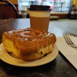 a pastry and a cup of coffee a pastry and a cup of coffee