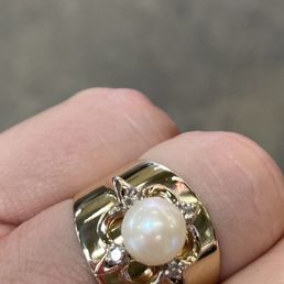 They took a vintage ring and all of its detail but created a wider more modern band and melded the two concepts