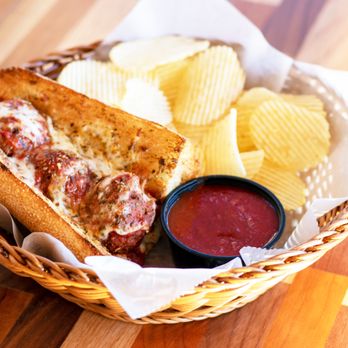 Dion's - A 6" meatball sub with chips and a side of marinara. - Pizza Near Me - Albuquerque, New Mexico