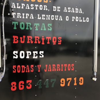 Taqueria Victoria - a sign for a taco truck - Tacos Near Me Taqueria Victoria - a sign for a taco truck - Tacos Near Me